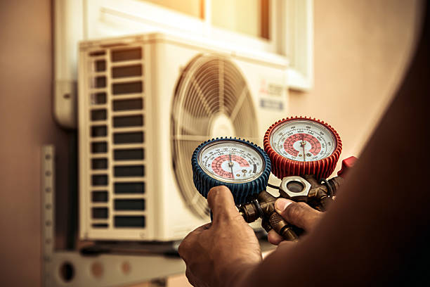 Professional Air Conditioning Service technician working in Gamaliel, KY